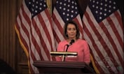 Pelosi Says Democrats to Unveil `Sweeping' Health Bill Tuesday