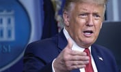 Trump Signs Virus Aid Bill After Panning $600 Stimulus Checks