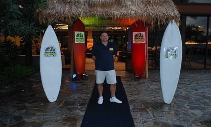 A happy man with surfboards