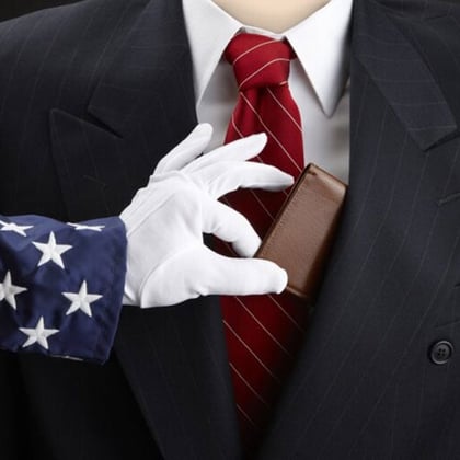 stock photo of uncle sam taking money out of a man's suit pocket
