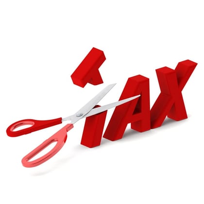 TAX in letters with scissors