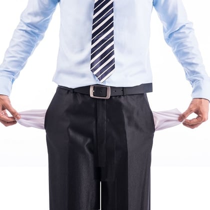 A businessperson with empty pockets. (Image: makistock/Shutterstock)