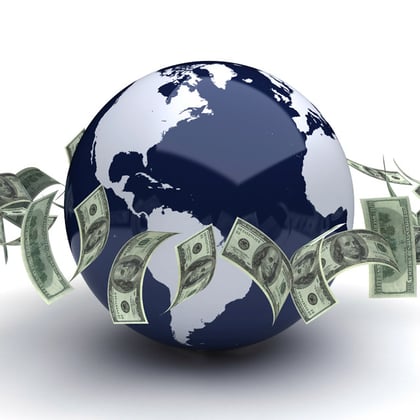 The Earth surrounded by dollar bills