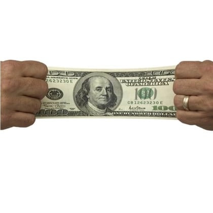 A stretched $100 bill (Image: Jason Stitt/Shutterstock)