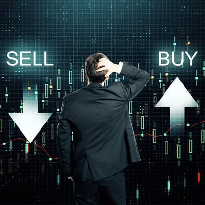 A man looking at a sell arrow pointing down and a buy arrow pointing up