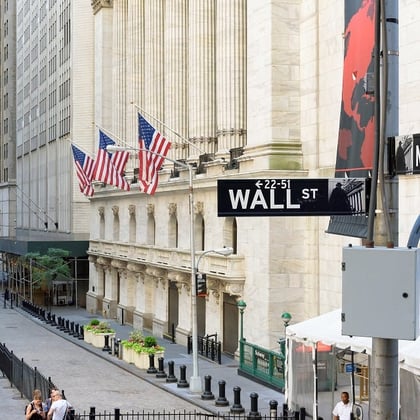 Shutterstock image of Wall Street in New York showing the sign and outside of the New York Stock Exchange.