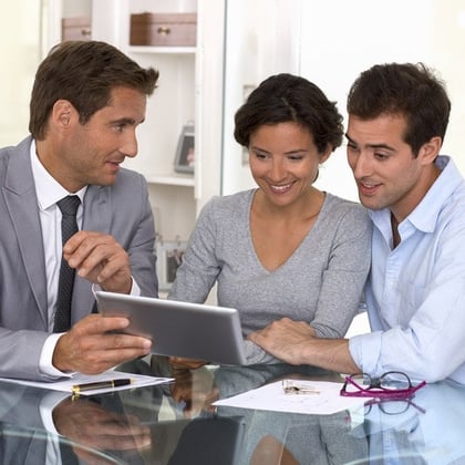 Financial advisor with a client couple