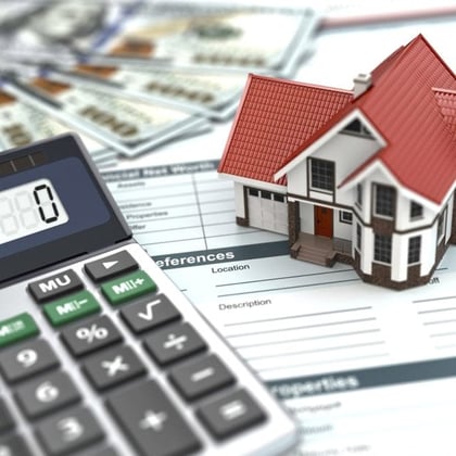 Estate planning image of small house and calculator