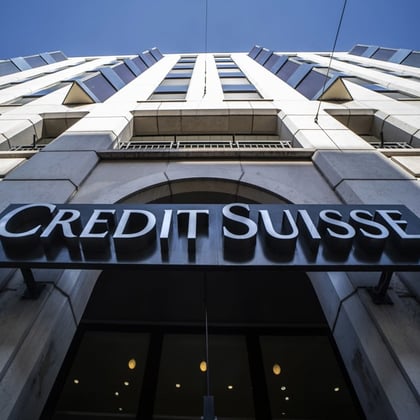 A sign above the entrance to a Credit Suisse Group AG bank branch in Geneva, Switzerland. (Photo: Bloomberg