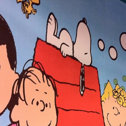Closeup of Snoopy from Peanuts on his dog house