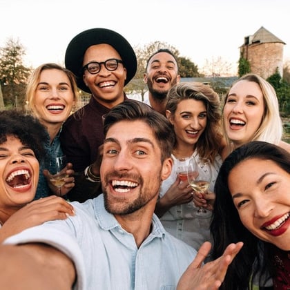Laughing young people taking a selfie.