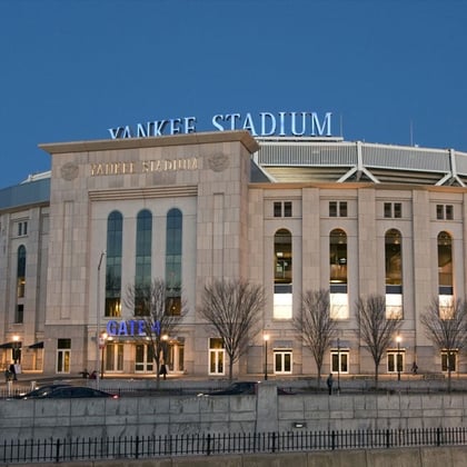 Yankee Stadium at night in Bronx, NY.