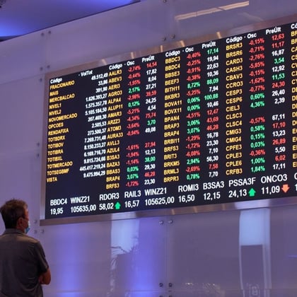 Man looking at a stock board in Brazil
