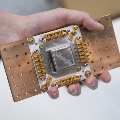 A package for super conducting quantum processors is displayed for a photograph by an employee during a Google AI event in San Francisco