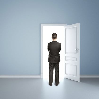 Businessman standing in a doorway