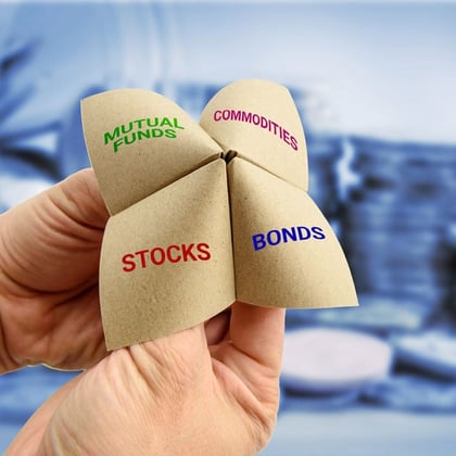 Stocks Bonds Mutual Funds Commodities words on folded paper