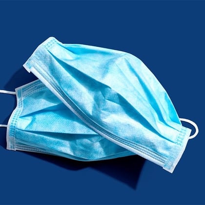 Photo of two blue surgical masks