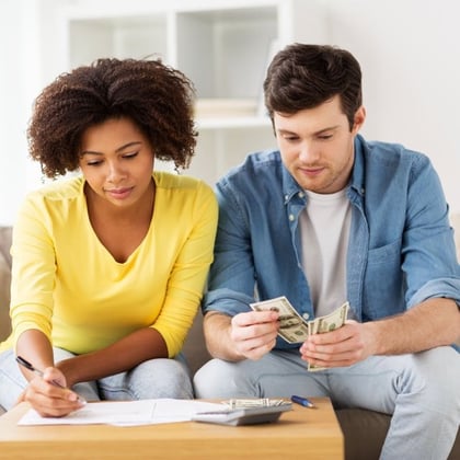 Young couple paying bills