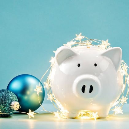 Piggy bank with Christmas lights and ornaments