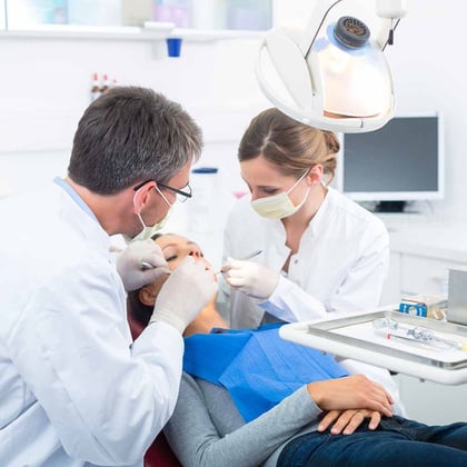 Dentist with a patient with having a dental treatment
