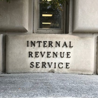 An IRS plaque on the wall of the IRS building.