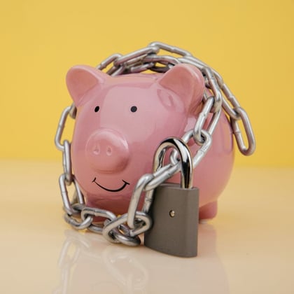 Piggy bank with a lock and chain