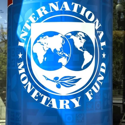 An International Monetary Fund banner at the IMF headquarters in Washington. Credit: Samual Corum/Bloomberg