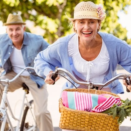 Retired couple riding bikes