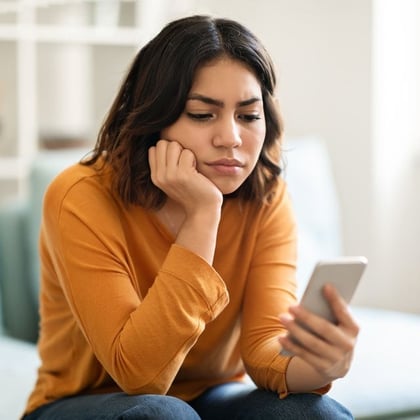 A young woman looking at her phone